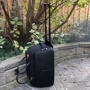Black carry on roller duffel